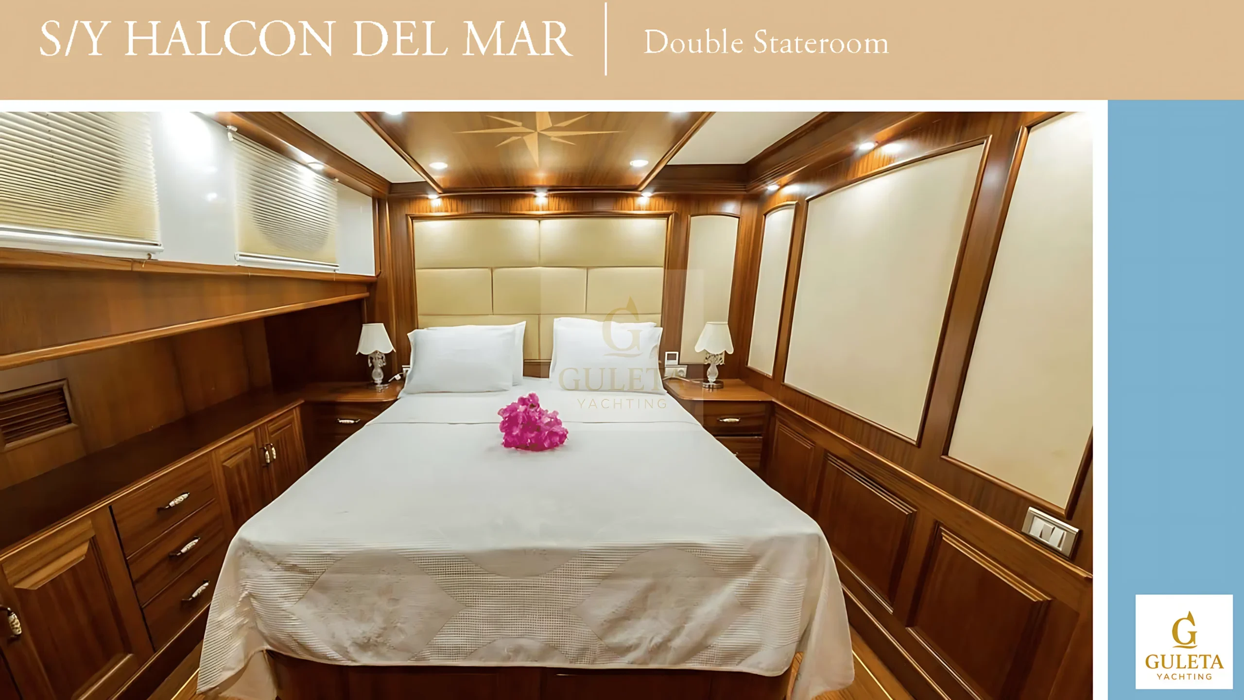Front view of a double cabin on Halcon Del Mar, showing the full bed, bedside lighting, and cozy atmosphere.