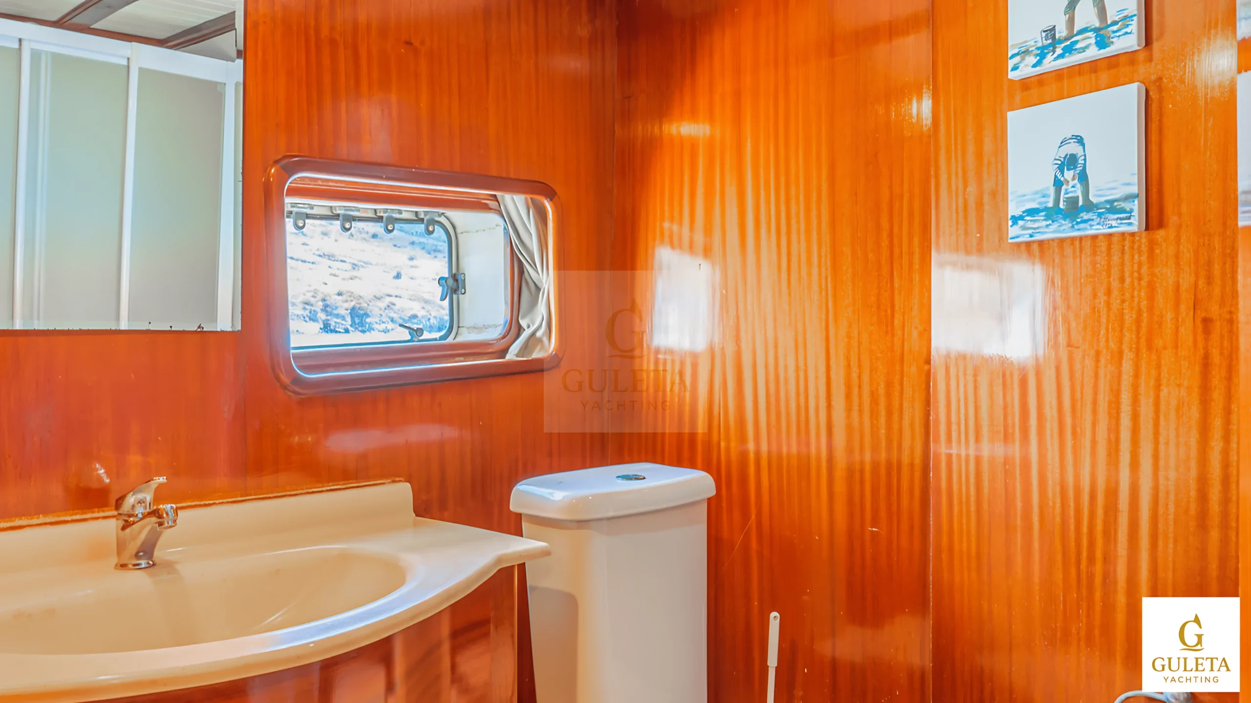 En-suite bathroom of Avrasya Gulet’s master cabin with modern sink, shower, and marble walls.