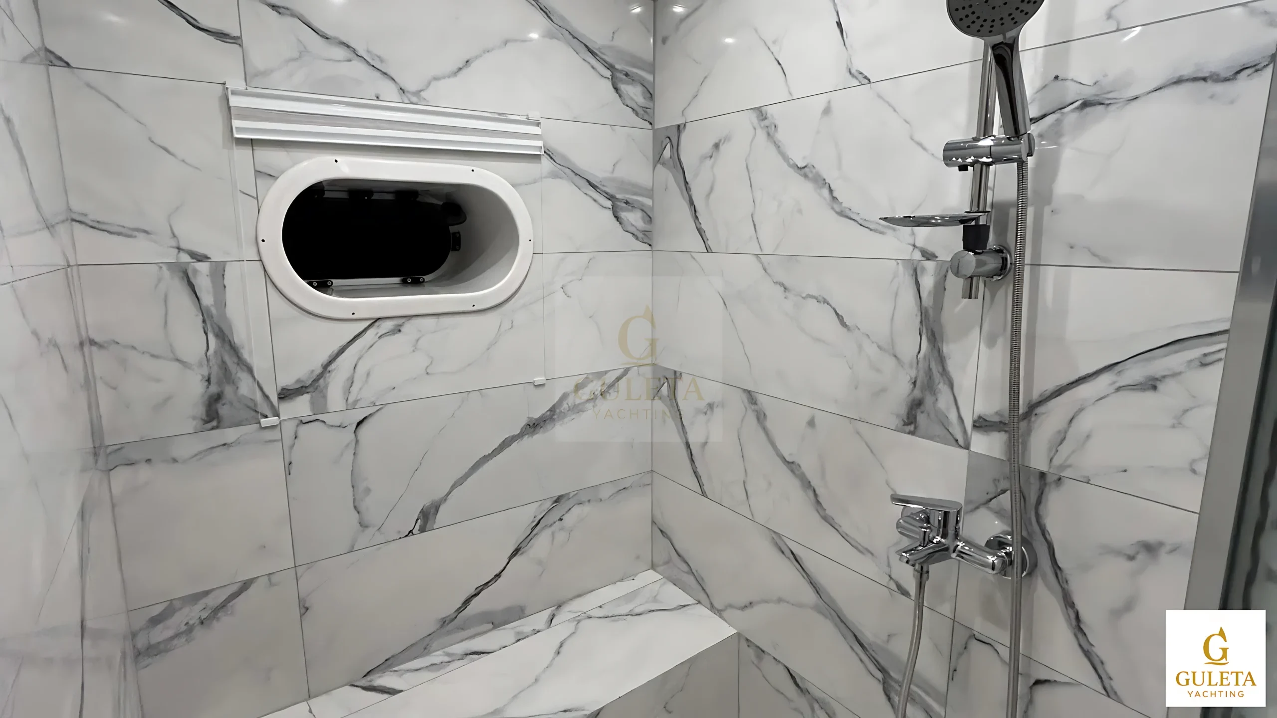 Private en-suite bathroom of the Master Cabin with shower and toilet amenities in Sulyar Gulet