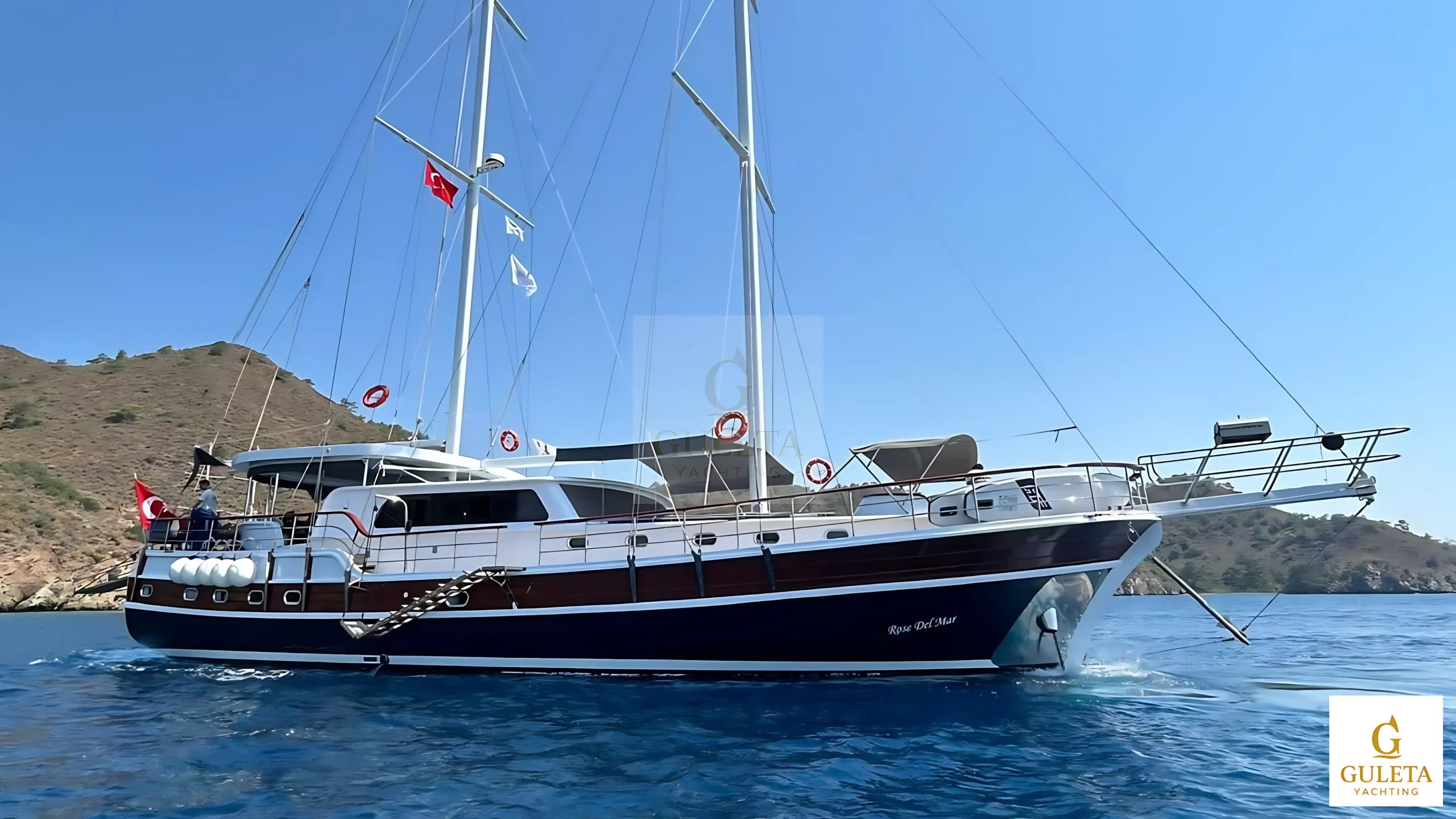 Rosa Del Mar Gulet wide-angle exterior view displaying the full vessel cruising along the Aegean Sea.