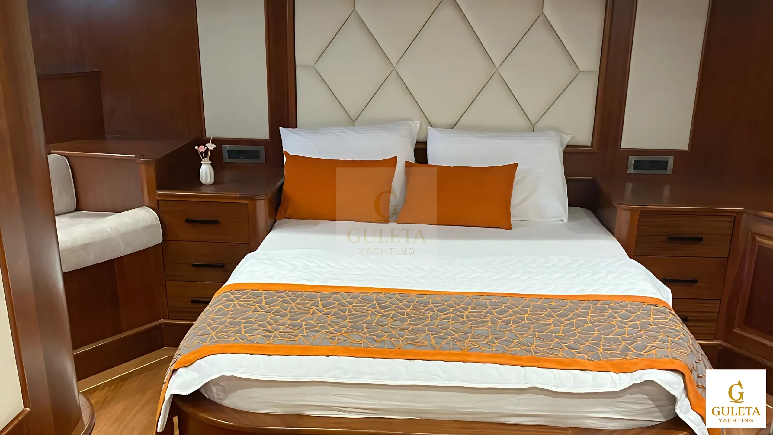 Rosa Del Mar Gulet double cabin featuring plush bedding and soft lighting for a restful experience.