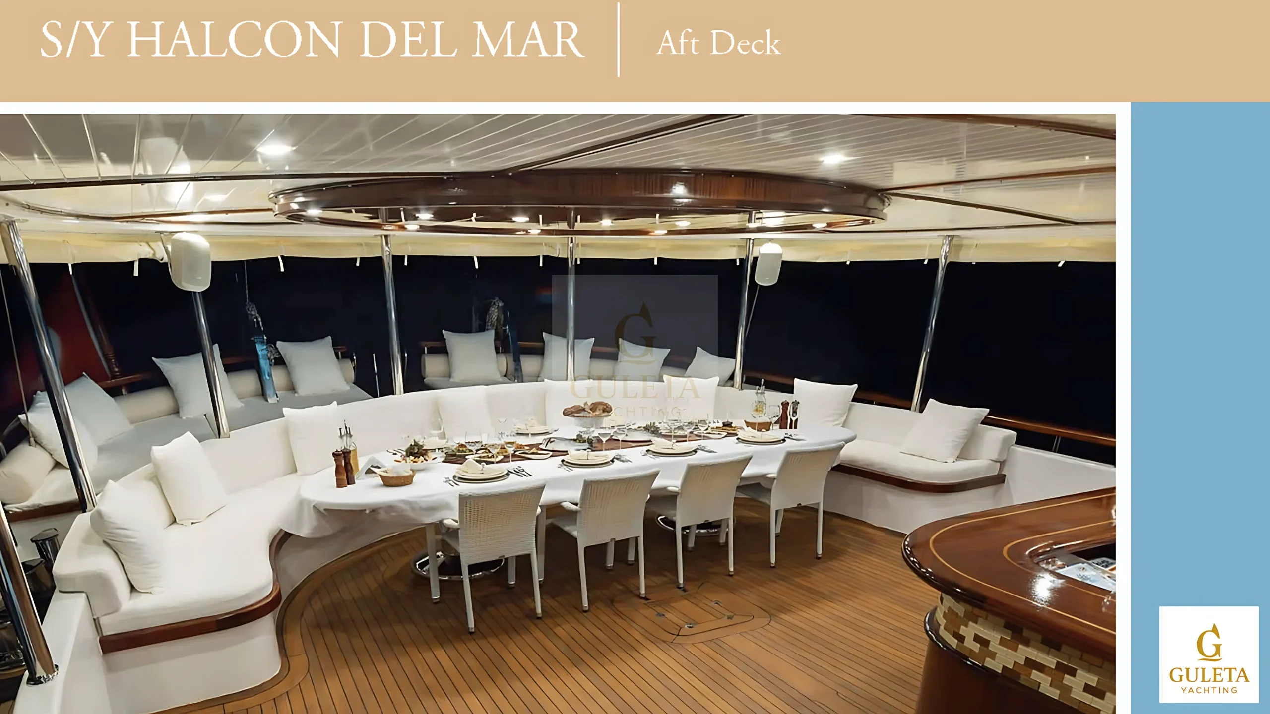 Luxury dinner setup on Halcon Del Mar’s aft deck at night, with ambient lighting creating an upscale alfresco dining experience.