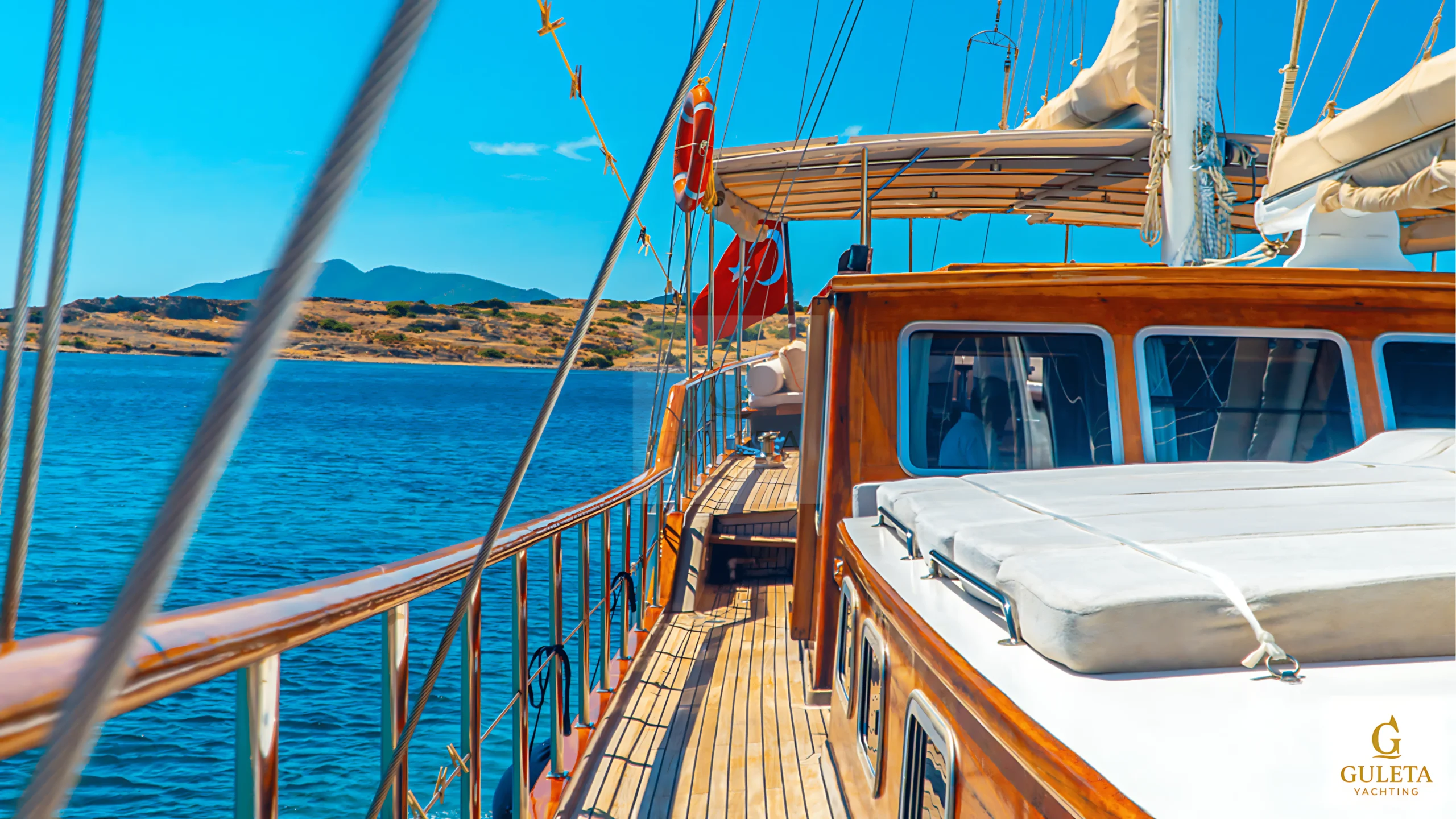 Side profile of Avrasya Gulet at anchor, displaying her classic lines and spacious deck.
