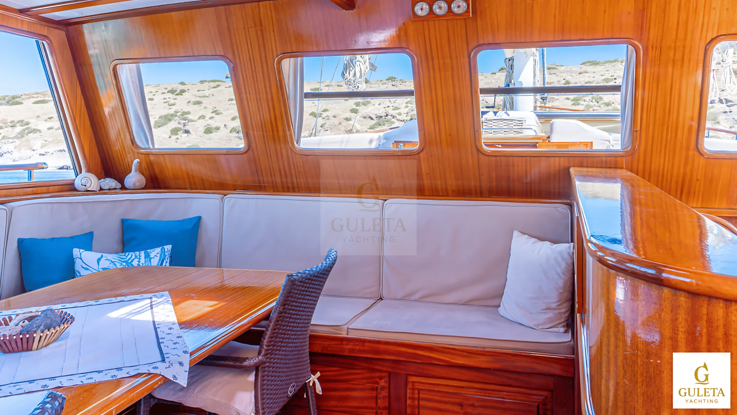 Comfortable seating area inside Avrasya Gulet featuring plush sofas and ambient lighting.