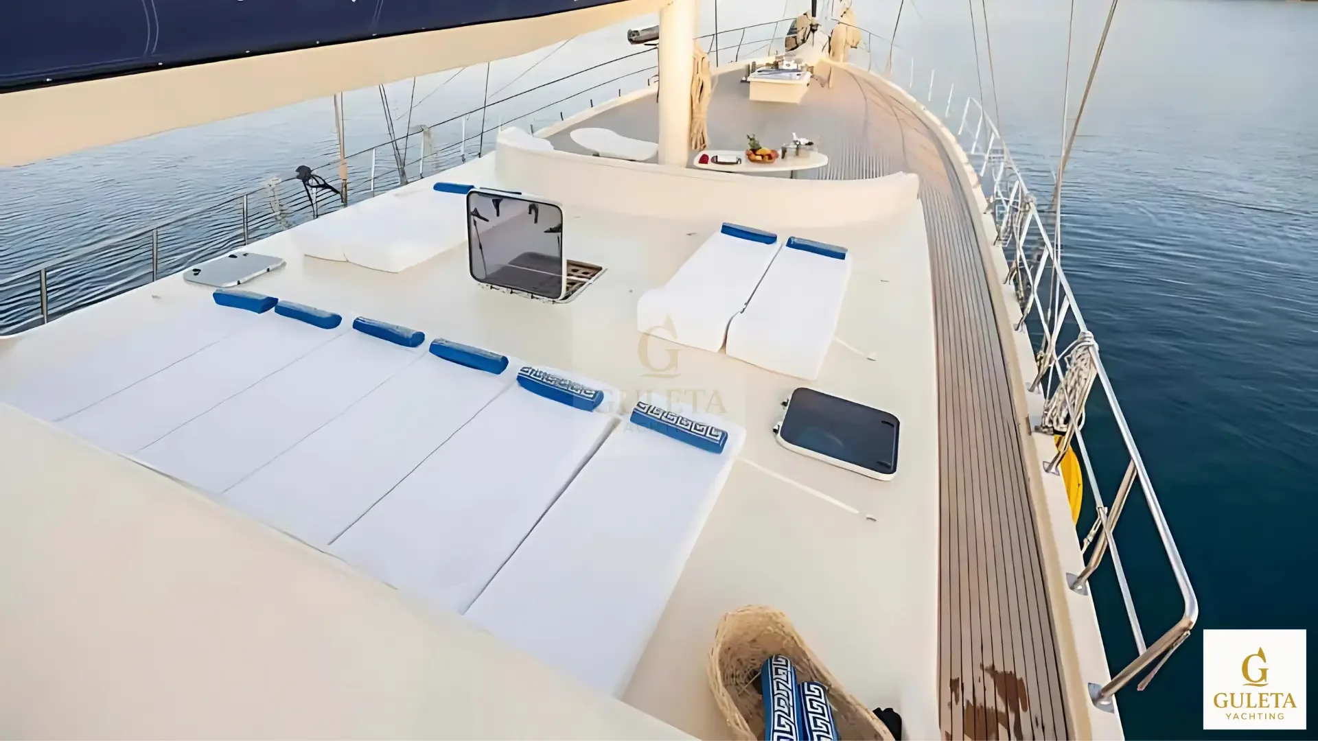 Upper deck of Junior Orçun Gulet with sunbeds and sea view