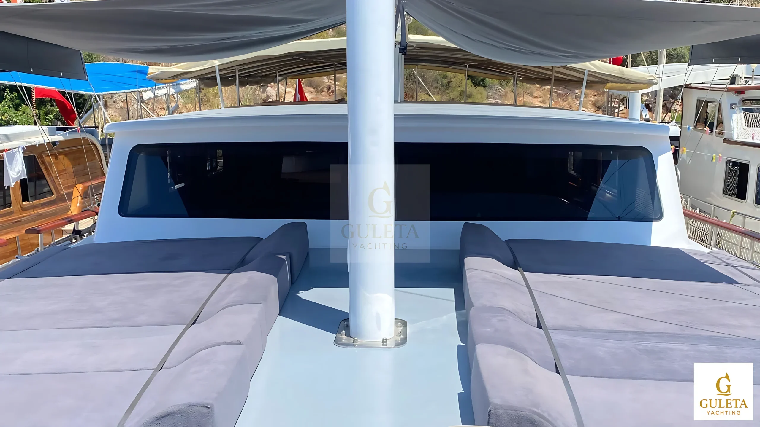 Rosa Del Mar Gulet front deck sunbed area offering spacious lounging space and scenic forward view.