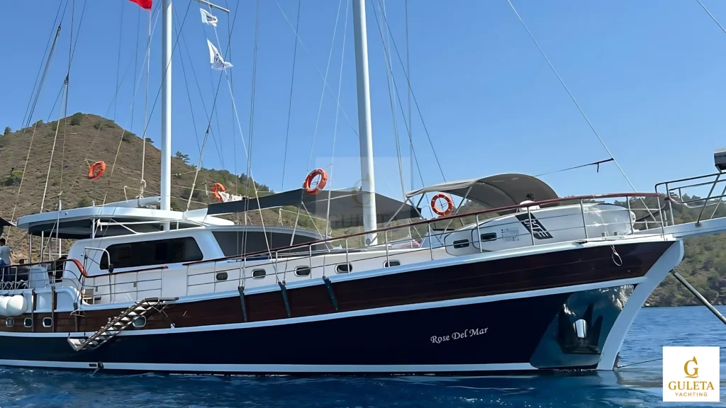 Rosa Del Mar Gulet with Guleta Yachting gold emblem, offering luxury yacht charter experiences in Turkey