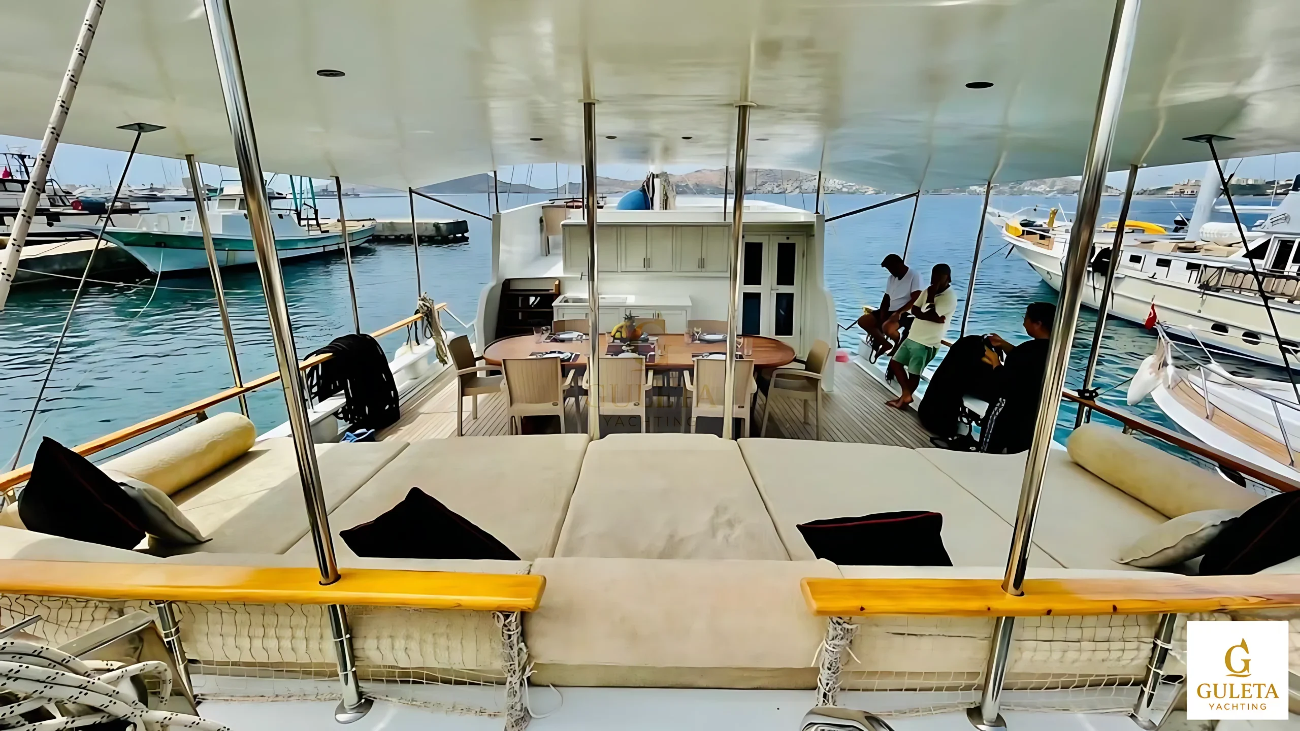 Spacious aft deck of Pam Due Gulet with seating and open view
