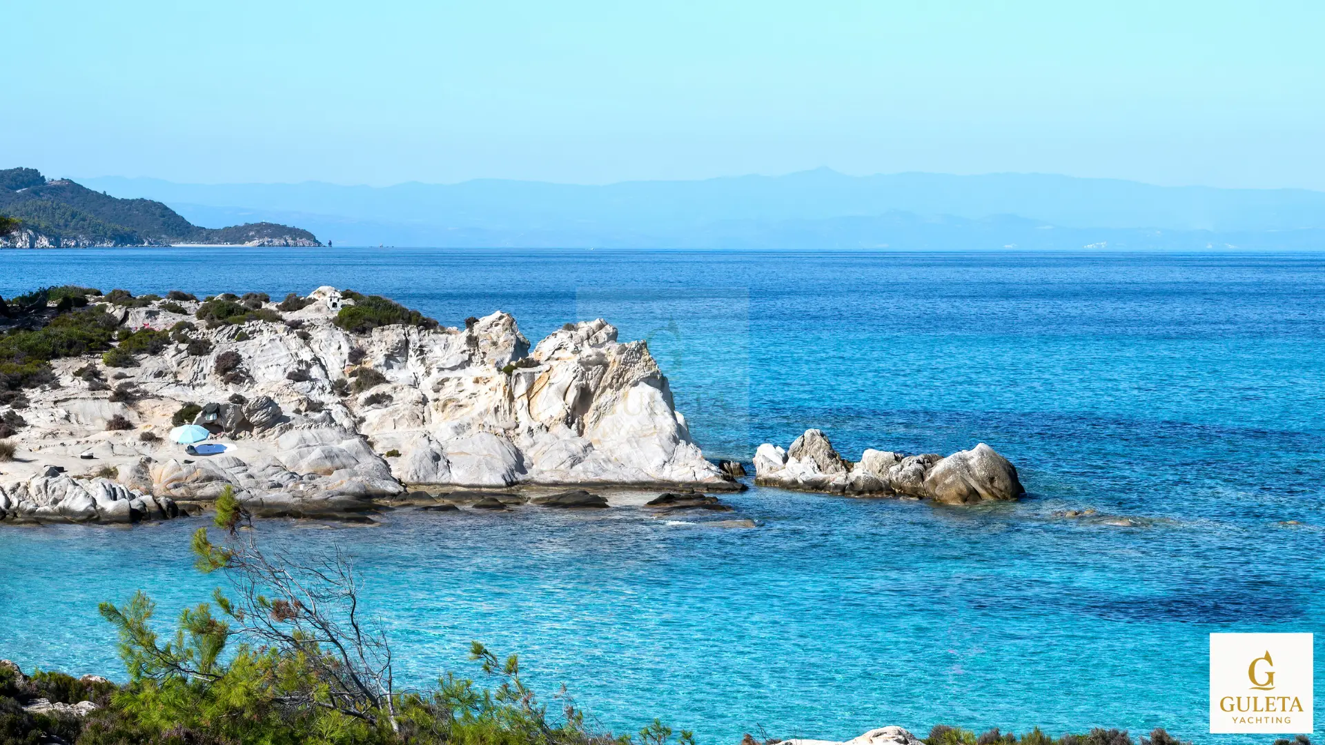 Crystal clear waters at Tilos island on a Greece gulet charter route

