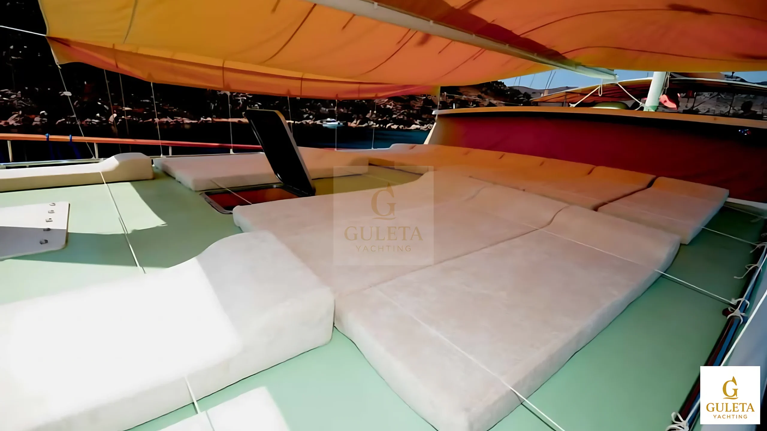 Sunbathing deck of the C.Taner II Gulet with comfortable loungers.