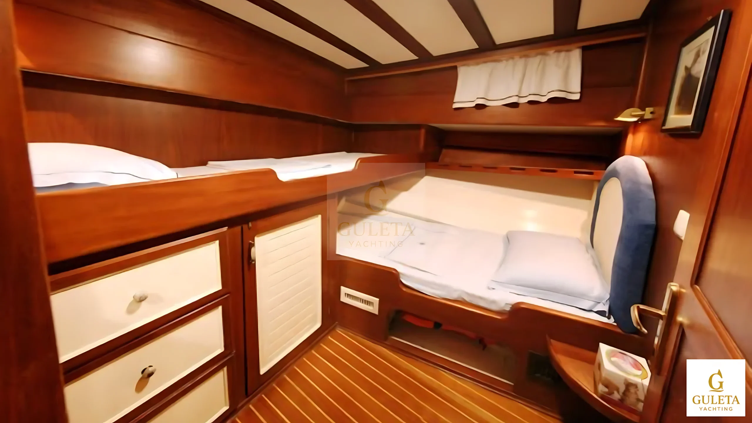 Cozy guest cabin on Kaptan Şevket Gulet with comfortable double bed.