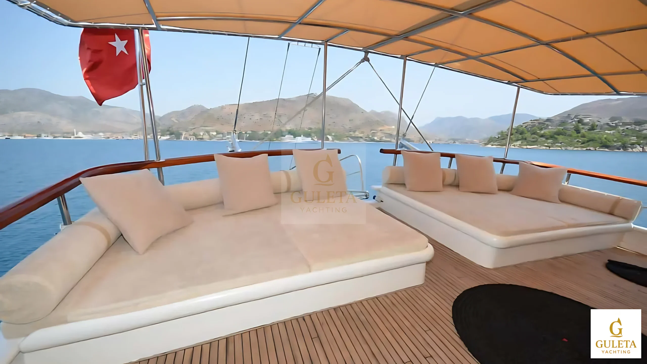 Aft deck seating area with cushions aboard the C.Taner II Gulet.