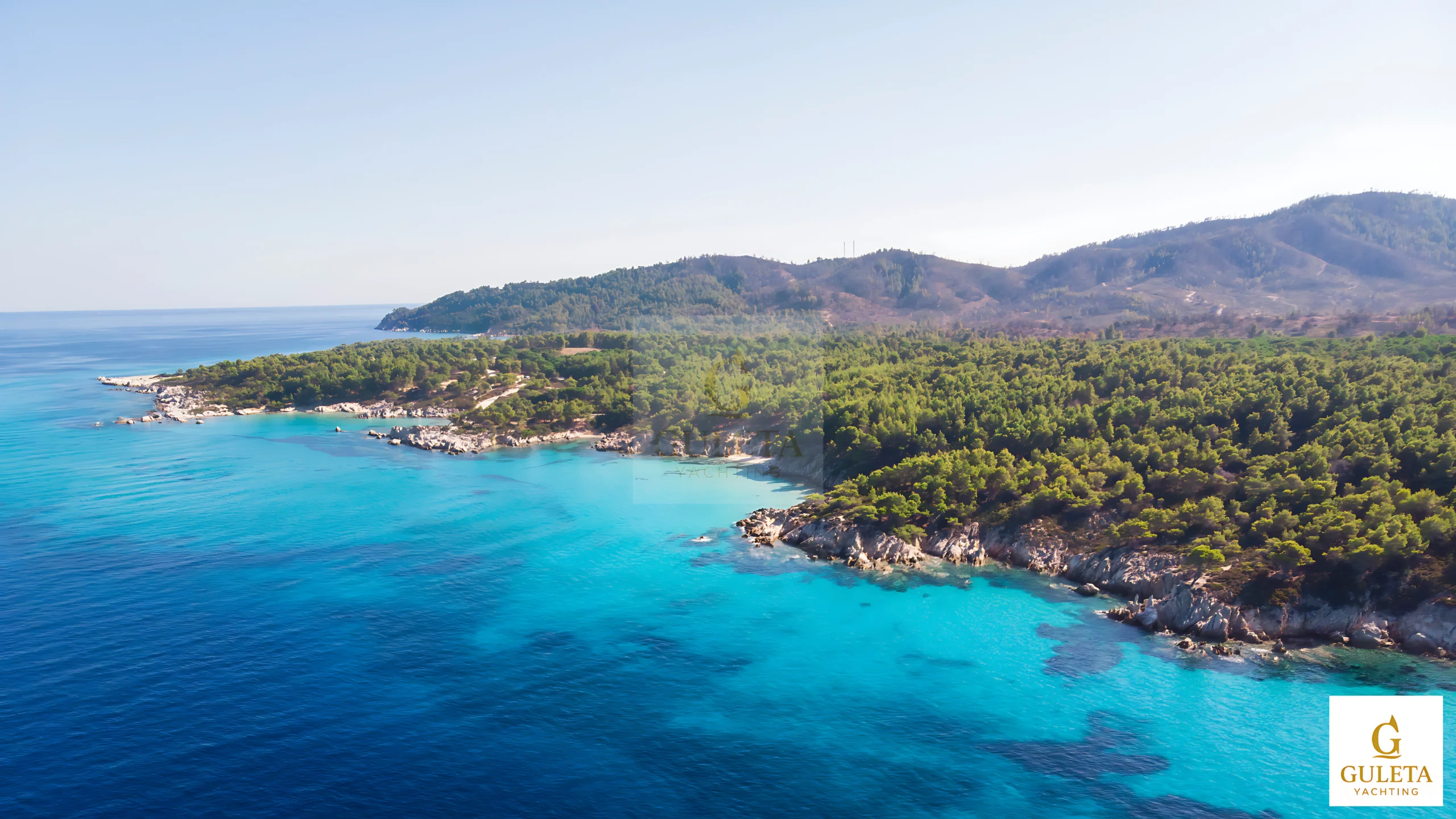 Byzantine ruins and turquoise waters in Kisebükü during a Gokova sailing tour
