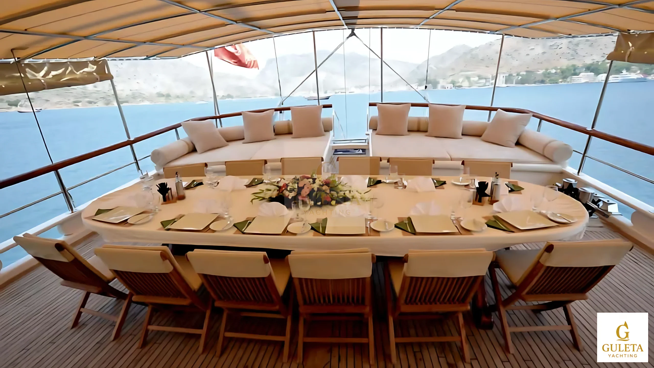 Dining table setup on the C.Taner II Gulet’s shaded aft deck.
