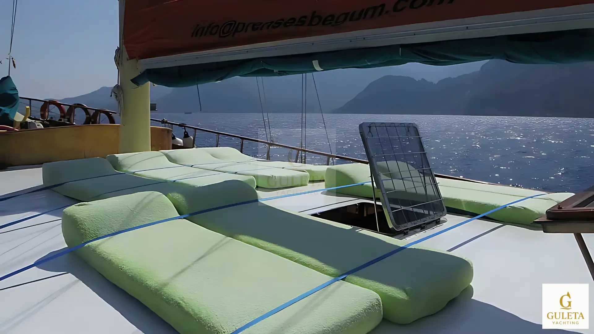Foredeck sunbathing and seating area with cushions on Prenses Begüm yacht